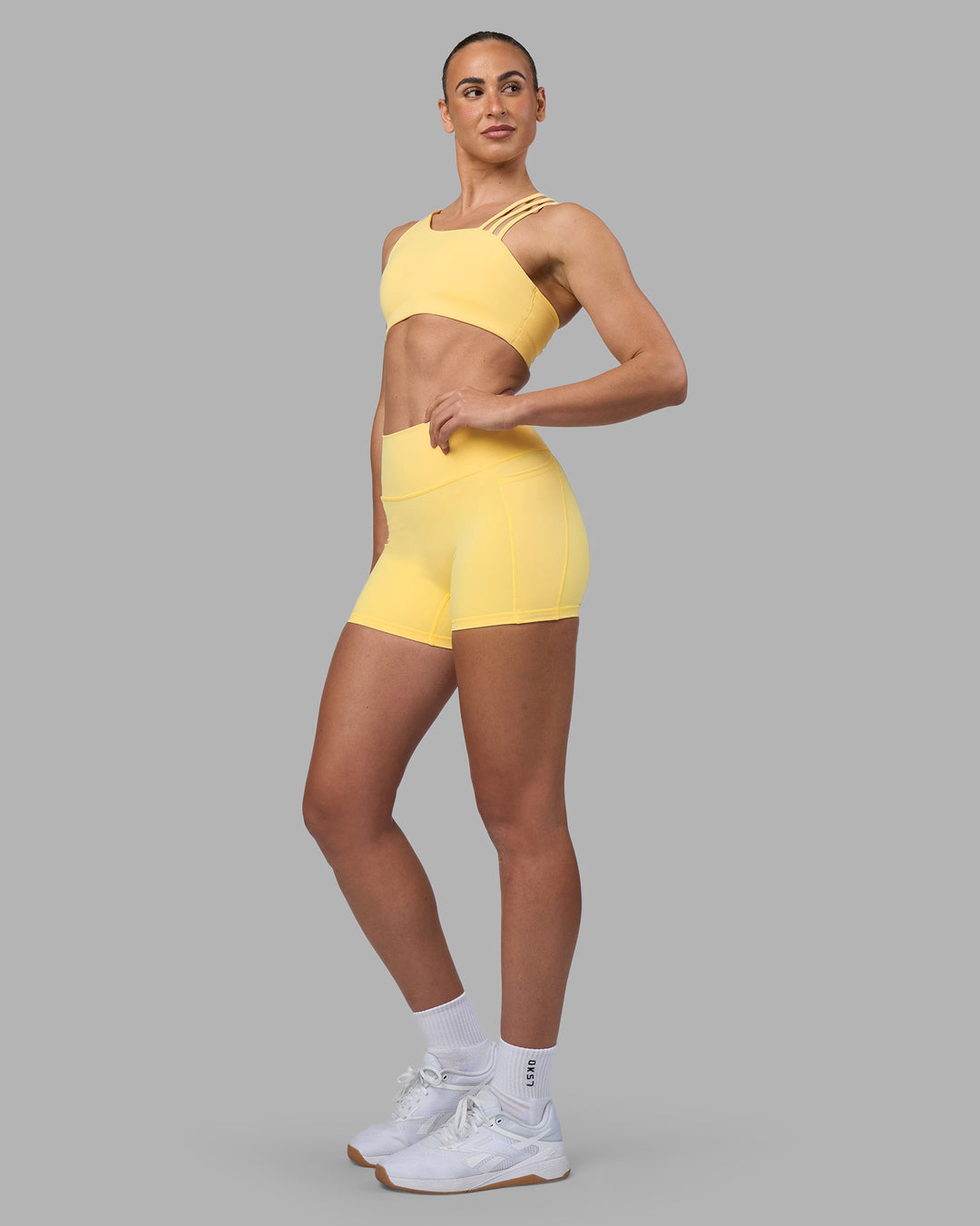 Woman wearing Galvanise Sports Bra 2.0 - Lemon | Model:Sophie | Size:S - view 5