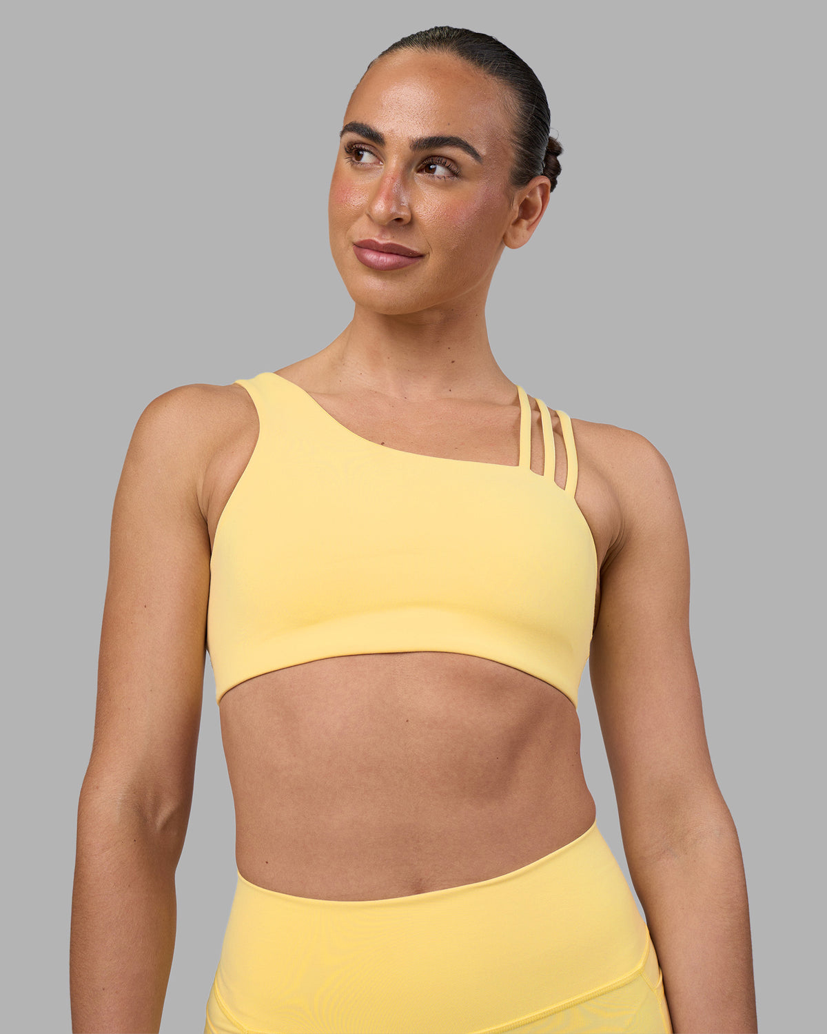 Woman wearing Galvanise Sports Bra 2.0 - Lemon | Set:true | Angle:front | Model:Sophie | Size:S