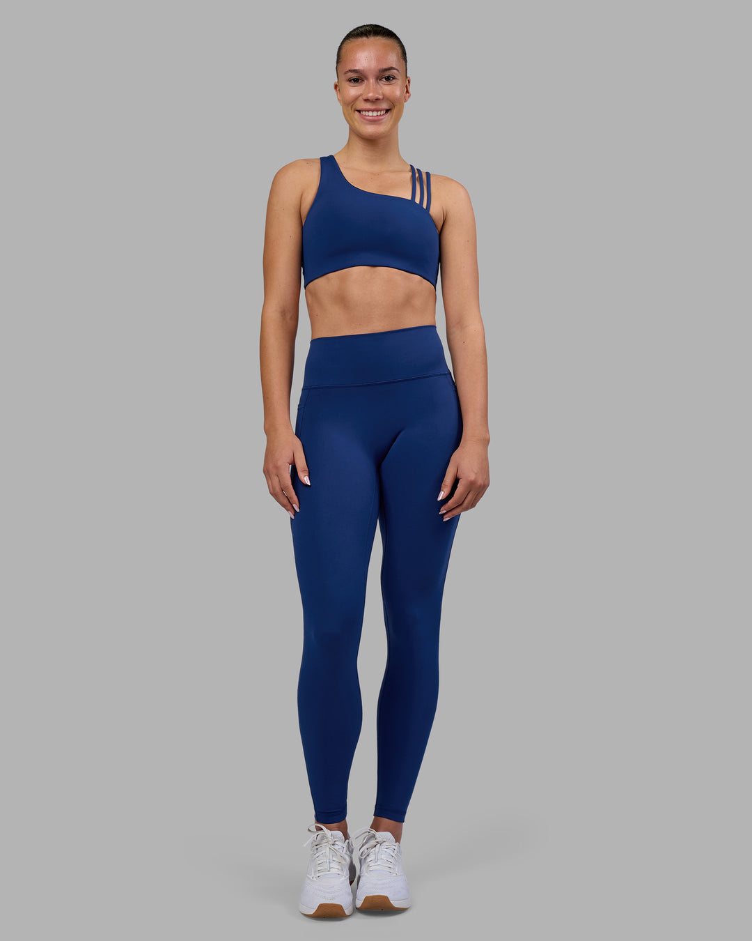Woman wearing Galvanise Sports Bra 2.0 - Midnight Blue | Model:Charlize | Size:S - view 3