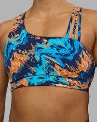 Woman wearing Galvanise Sports Bra 2.0 - React Print | Set:true | Angle:closeup | Model:Georgia | Size:S | Thumbnail Index: 6