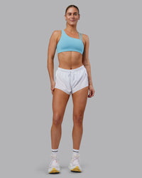 Woman wearing Galvanise Sports Bra 2.0 - Retro Blue | Model:Hannah | Size:S | Thumbnail Index: 2