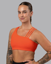 Woman wearing Galvanise Sports Bra 2.0 - Ultra Orange | Set:true | Angle:front | Model:Robyn | Size:S | Thumbnail Index: 0