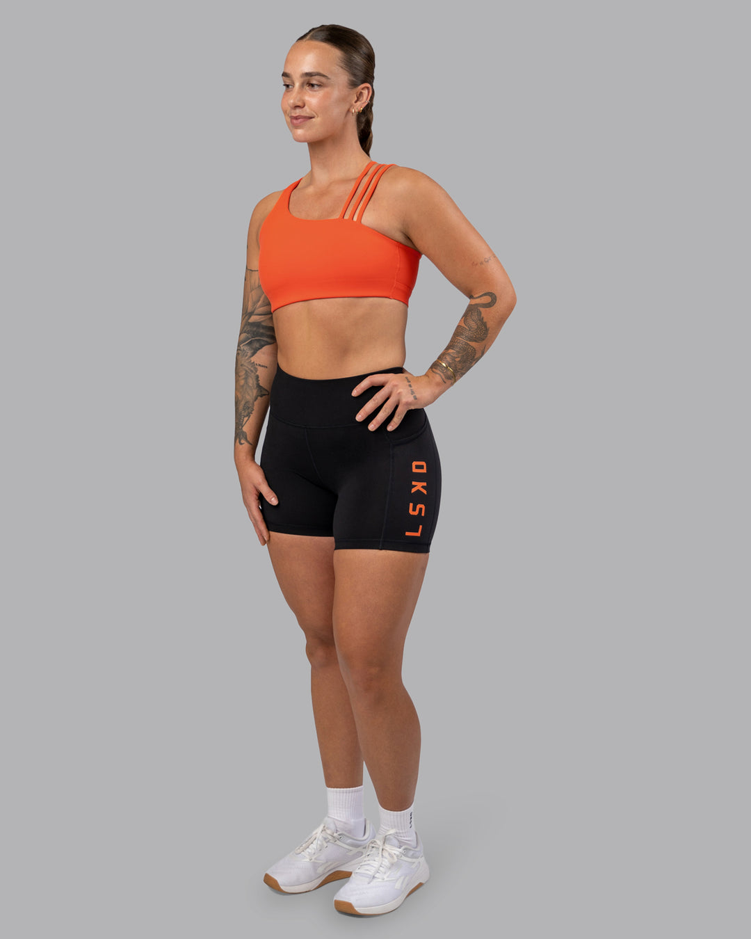 Woman wearing Galvanise Sports Bra 2.0 - Ultra Orange | Model:Robyn | Size:S - view 6
