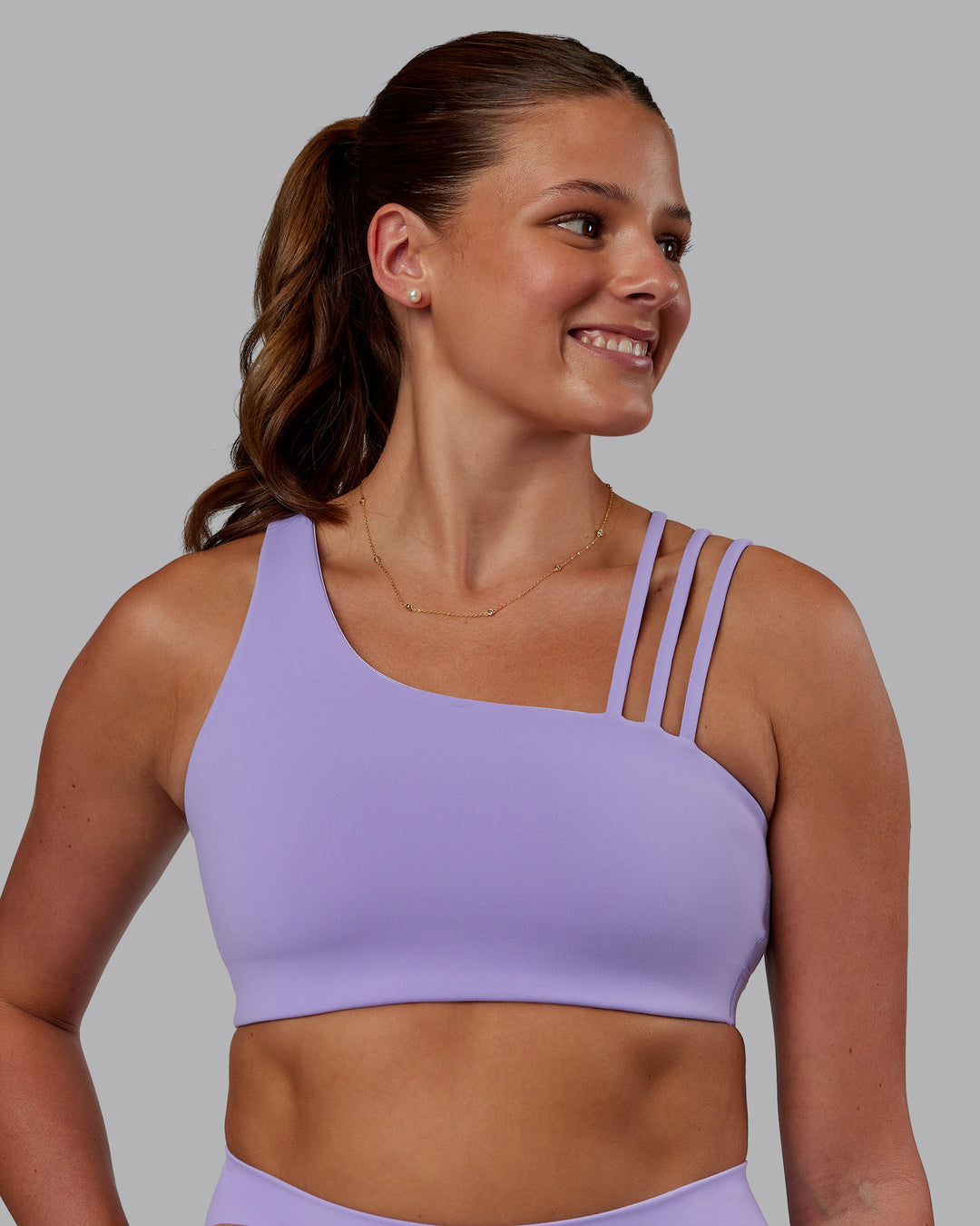 Woman wearing Galvanise Sports Bra 2.0 - Violet Ray | Model:Phoebe | Size:S - view 1