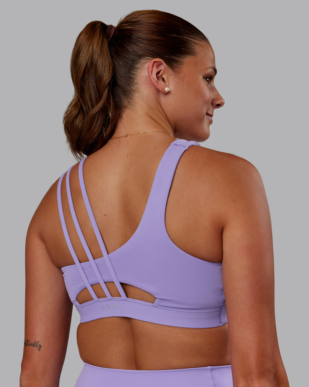 Woman wearing Galvanise Sports Bra 2.0 - Violet Ray | Model:Phoebe | Size:S - view 2
