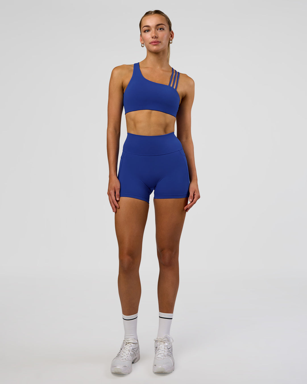 Woman wearing Galvanise Sports Bra 2.0 - Electric Indigo | Model:Evie | Size:S - view 3