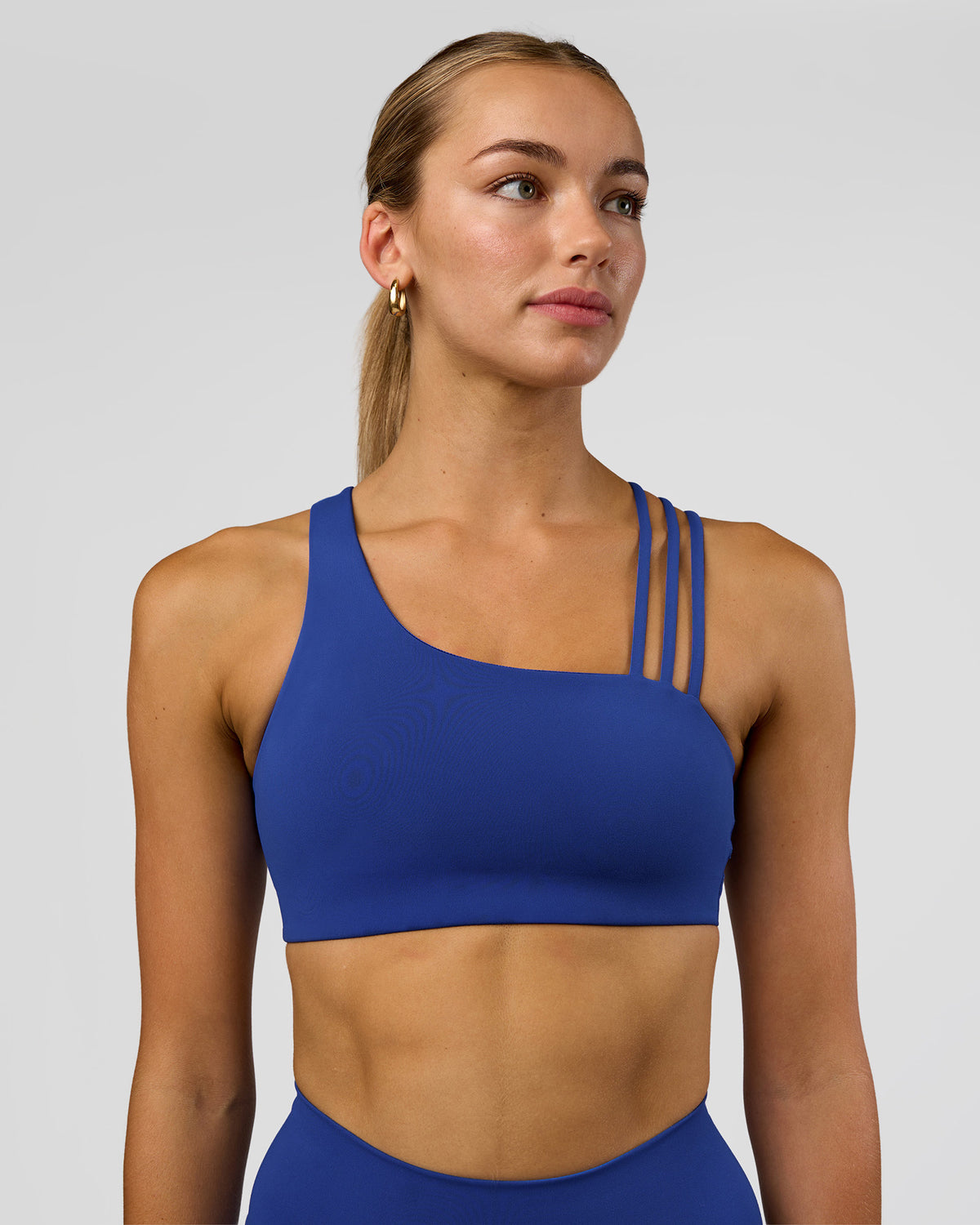 Woman wearing Galvanise Sports Bra 2.0 - Electric Indigo | Set:true | Angle:front | Model:Evie | Size:S