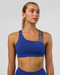 Woman wearing Galvanise Sports Bra 2.0 - Electric Indigo | Set:true | Angle:front | Model:Evie | Size:S | Thumbnail Index: 0