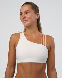 Woman wearing Galvanise Sports Bra 2.0 - Off White-Multi | Set:true | Angle:front | Model:Amity | Size:S | Thumbnail Index: 2