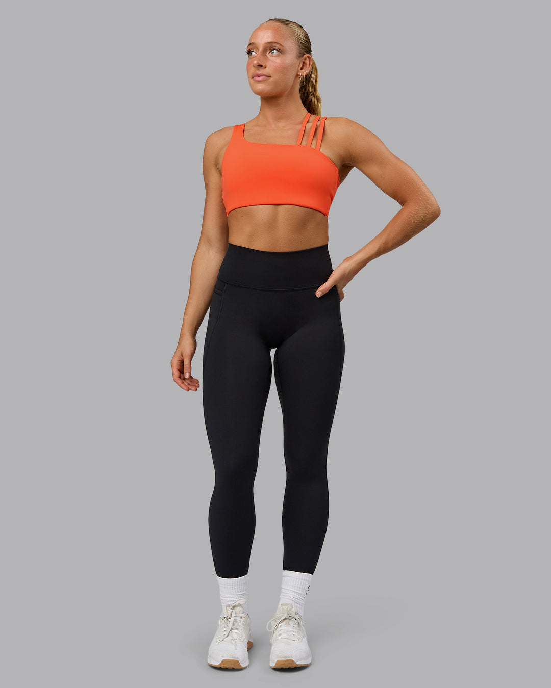 Woman wearing Galvanise Sports Bra - Ultra Orange - view 4