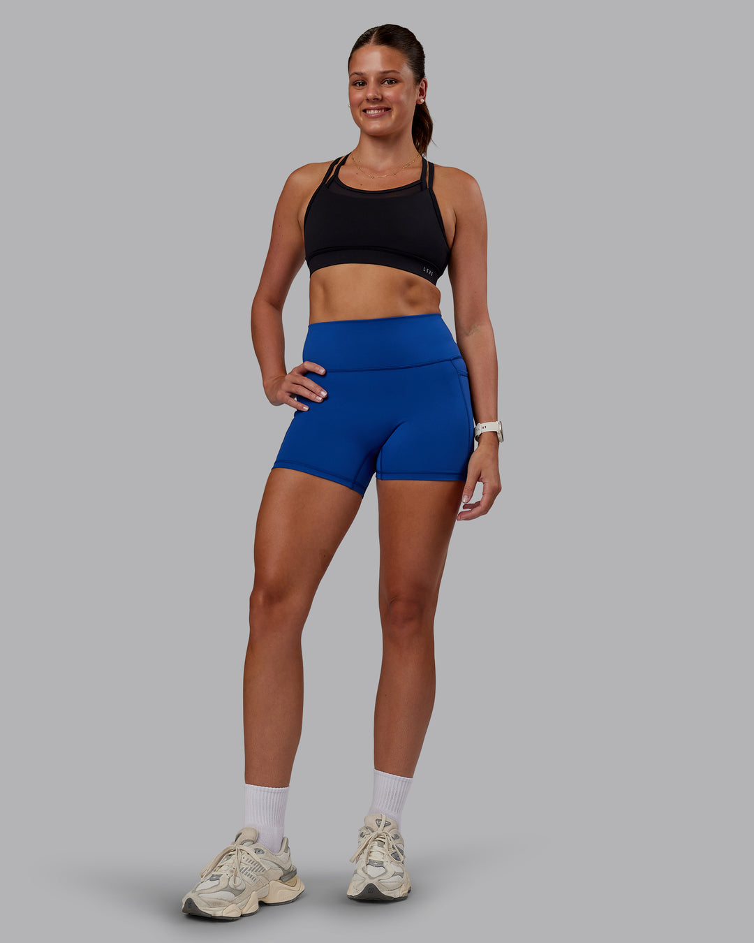 Woman wearing Genesis Layered Sports Bra - Black | Model:Phoebe | Size:S - view 5