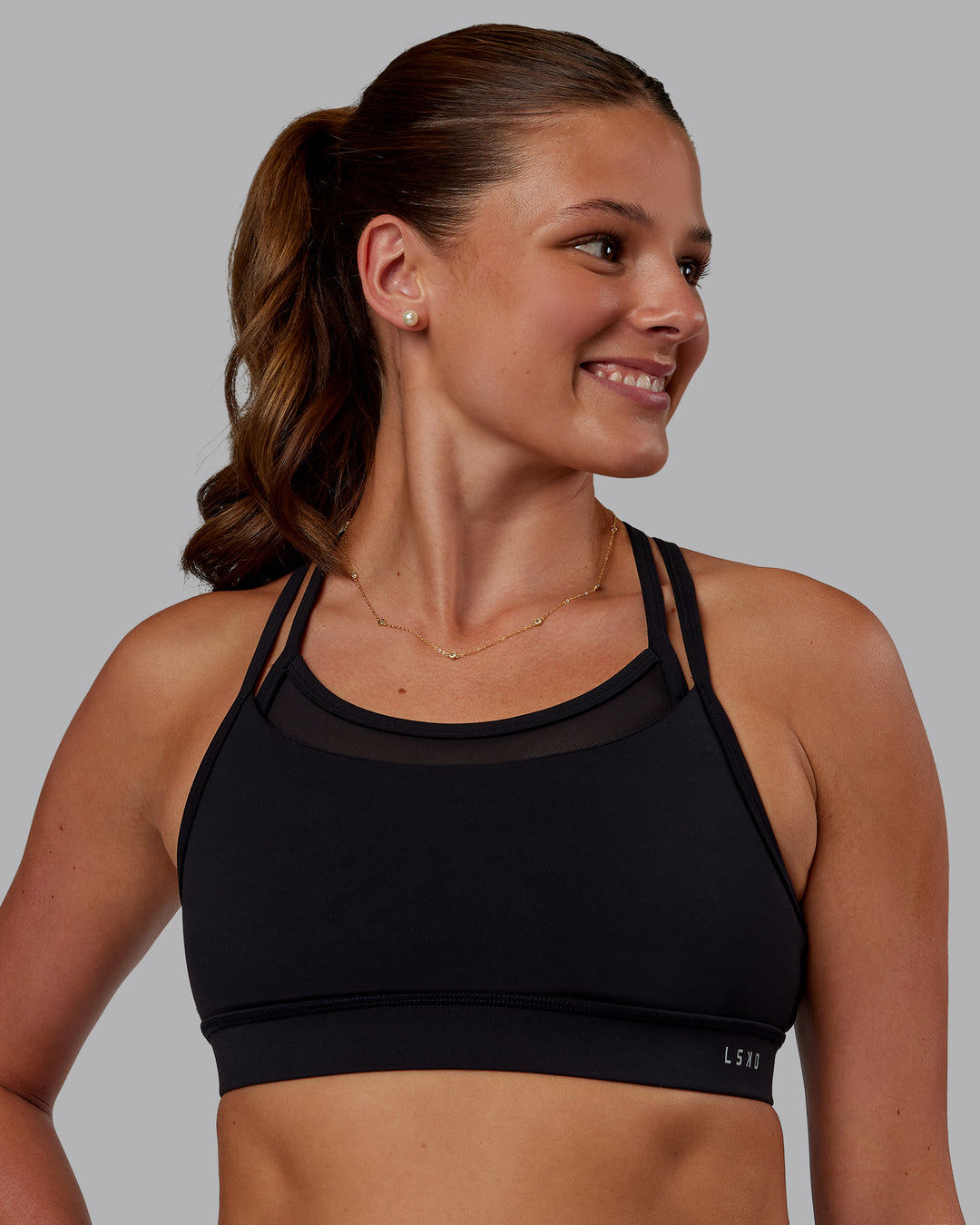 Woman wearing Genesis Layered Sports Bra - Black | Model:Phoebe | Size:S - view 3