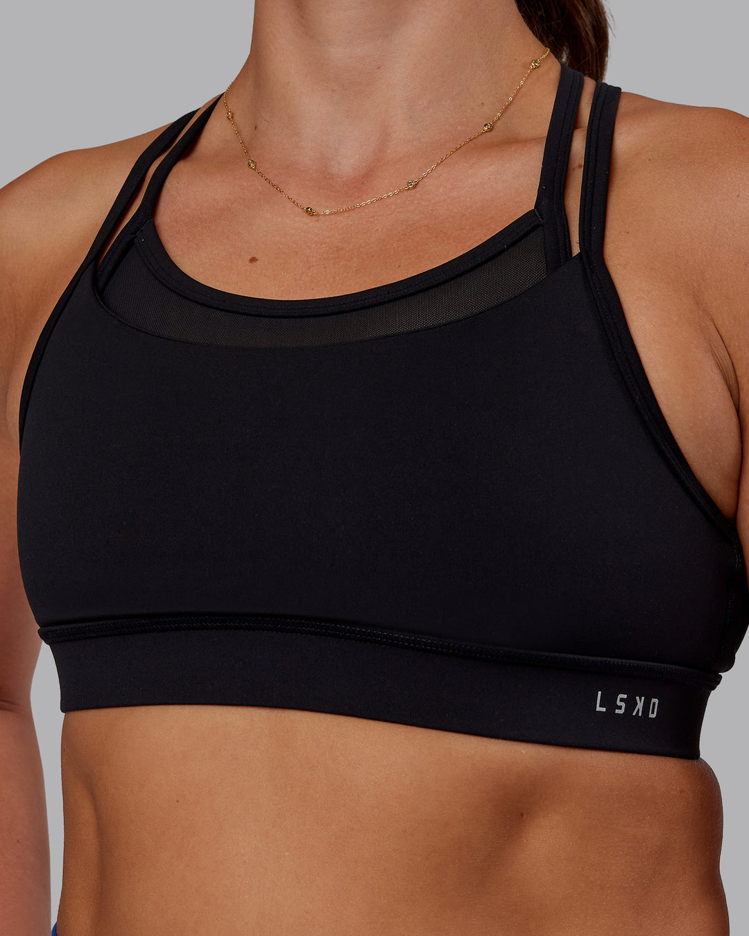 Woman wearing Genesis Layered Sports Bra - Black | Model:Phoebe | Size:S - view 7
