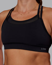 Woman wearing Genesis Layered Sports Bra - Black | Model:Phoebe | Size:S | Thumbnail Index: 6