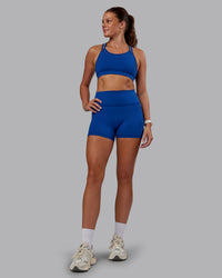 Woman wearing Genesis Layered Sports Bra - Blue Quartz | Model:Phoebe | Size:S | Thumbnail Index: 4