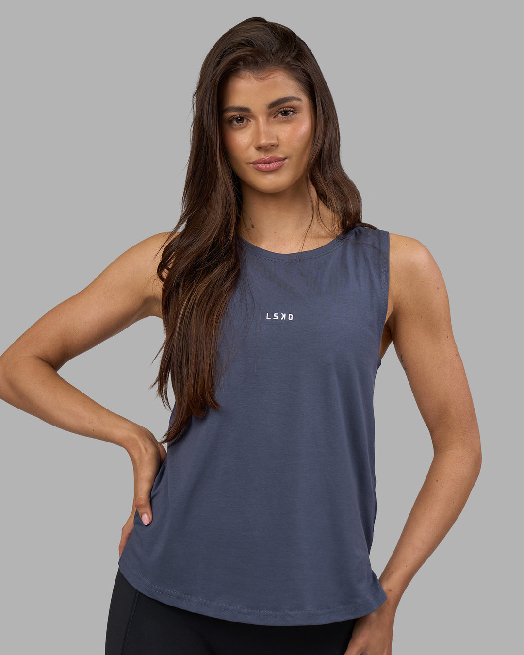 Woman wearing Go-To FLXCotton Longline Tank - Night Shadow-White | Model:Phoebe | Size:S - view 2