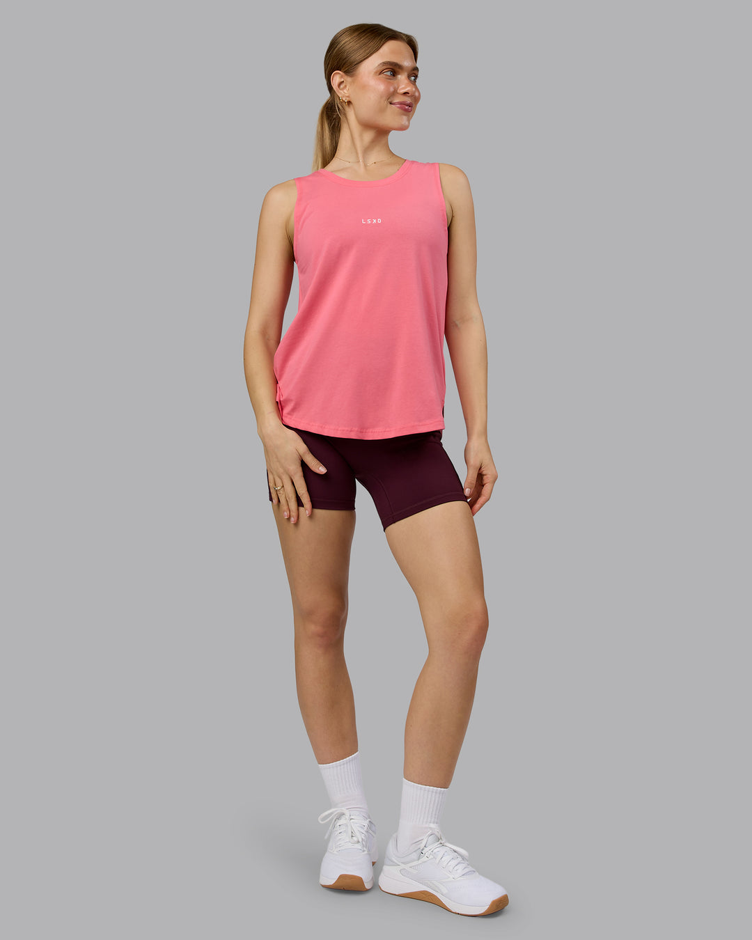 Woman wearing Go-To FLXCotton Longline Tank - Pink Lemonade-White | Model:Emilie | Size:S - view 5