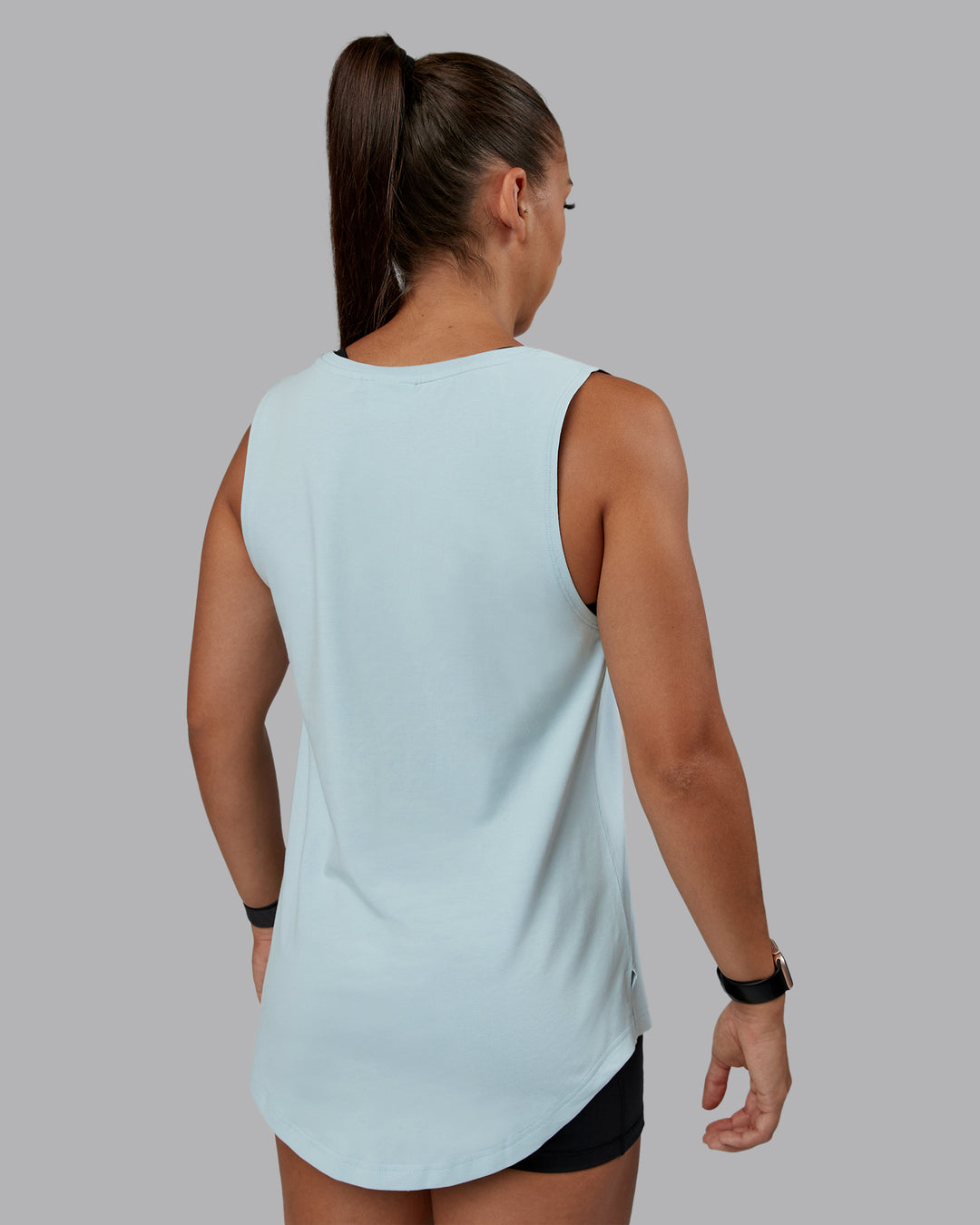 Woman wearing Go-To FLXCotton Longline Tank - Skyride-White | Size:S | Model:Tylah - view 3