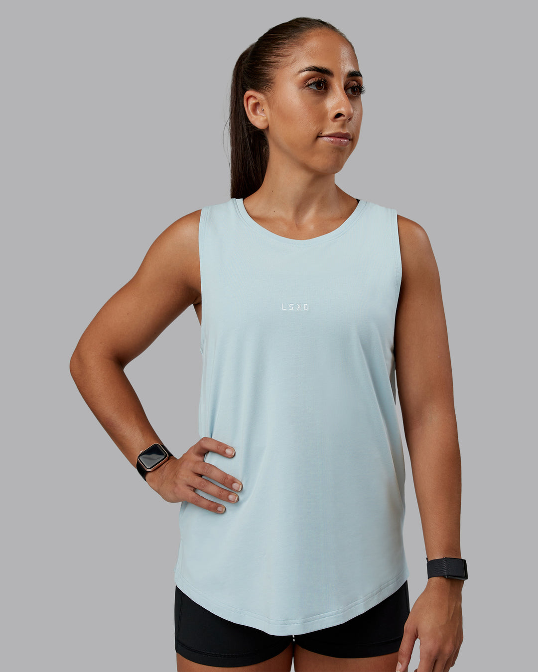 Woman wearing Go-To FLXCotton Longline Tank - Skyride-White | Size:S | Model:Tylah - view 1