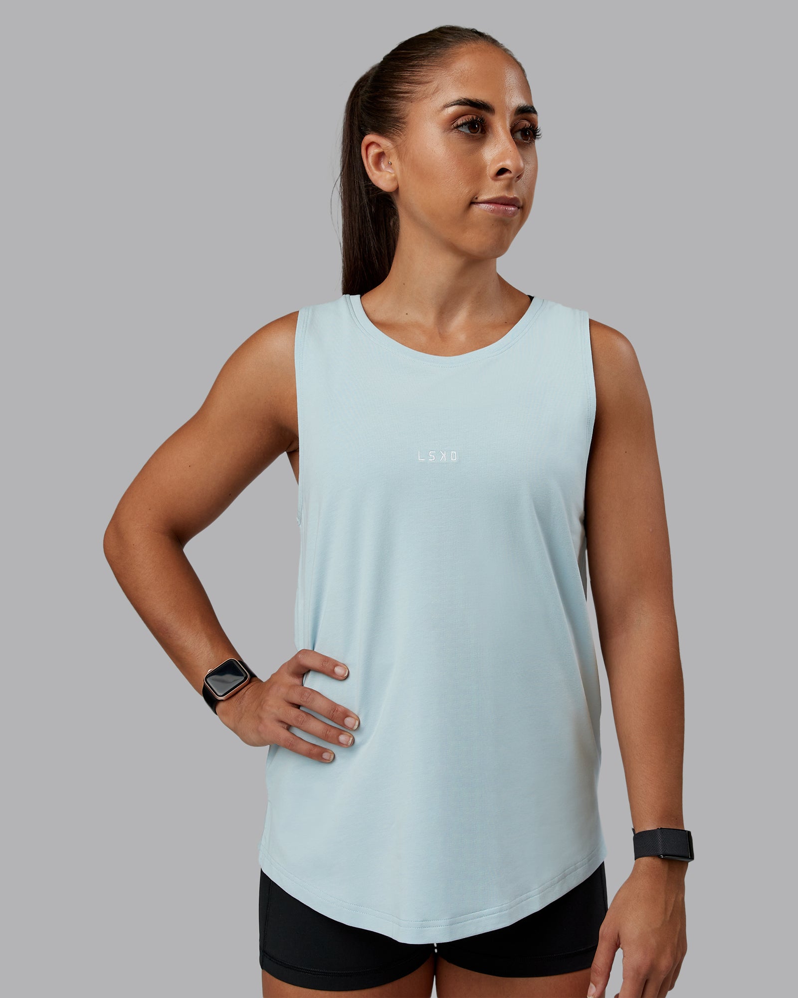 Woman wearing Go-To FLXCotton Longline Tank - Skyride-White | Size:S | Model:Tylah