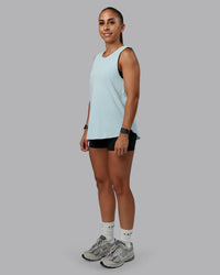 Woman wearing Go-To FLXCotton Longline Tank - Skyride-White | Size:S | Model:Tylah | Thumbnail Index: 1
