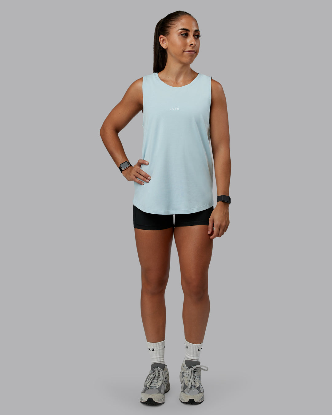 Woman wearing Go-To FLXCotton Longline Tank - Skyride-White | Size:S | Model:Tylah - view 4