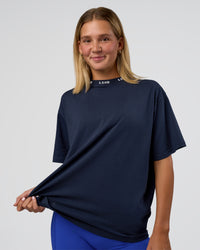 Woman wearing Go-To FLXCotton Oversized Deviation Tee - Future Navy-White | Model:Amity | Size:S | Thumbnail Index: 0