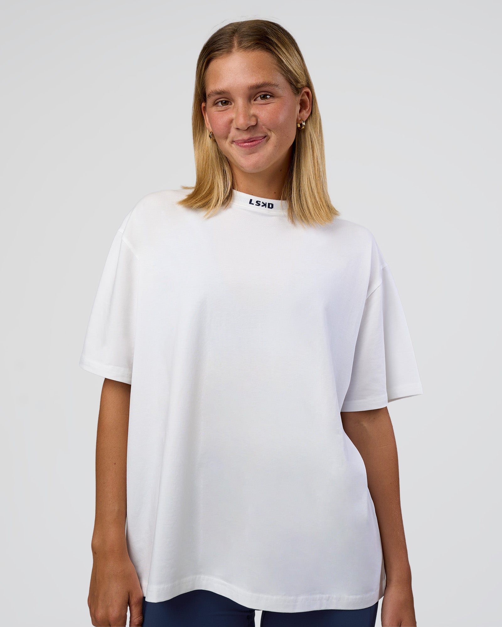 Woman wearing Go-To FLXCotton Oversized Deviation Tee - White-Future Navy | Model:Amity | Size:S