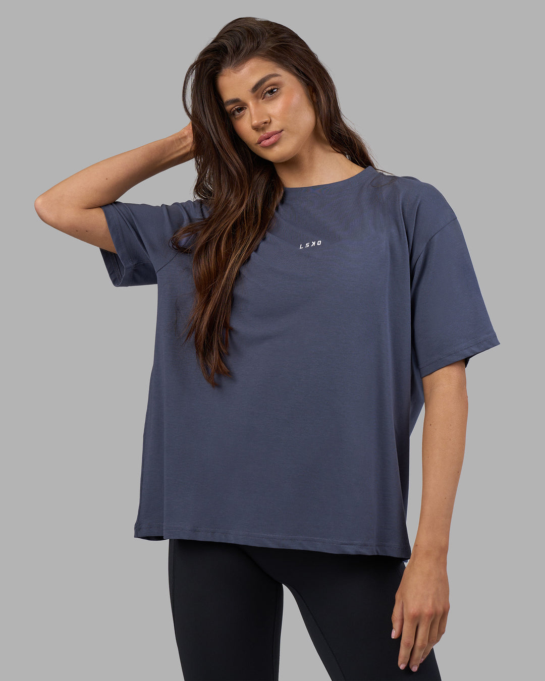 Woman wearing Go-To FLXCotton Oversized Tee - Night Shadow-White | Model:Phoebe | Size:S - view 1