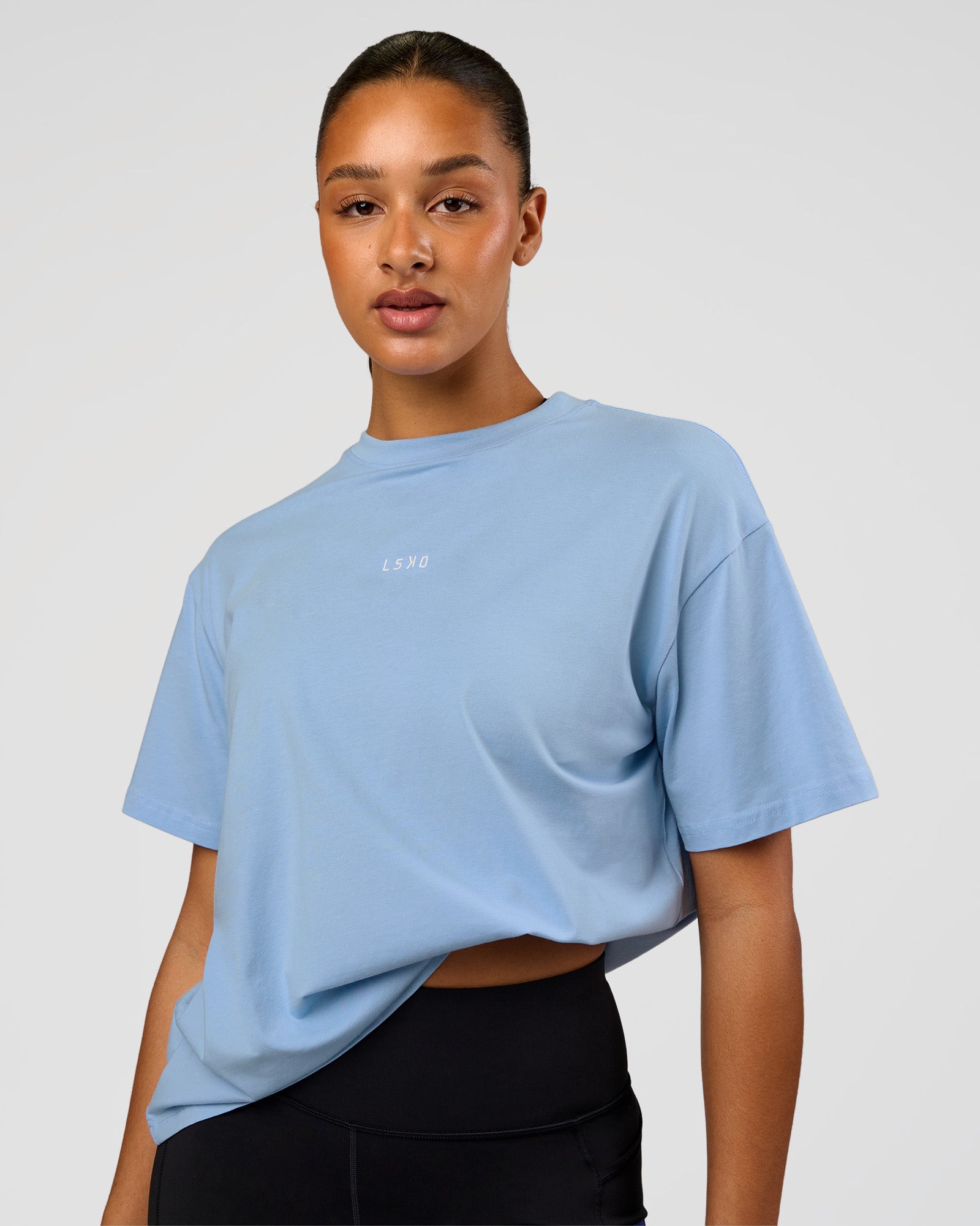 Woman wearing Go-To FLXCotton Oversized Tee - Open Air-White | Model:Rosie | Size:S