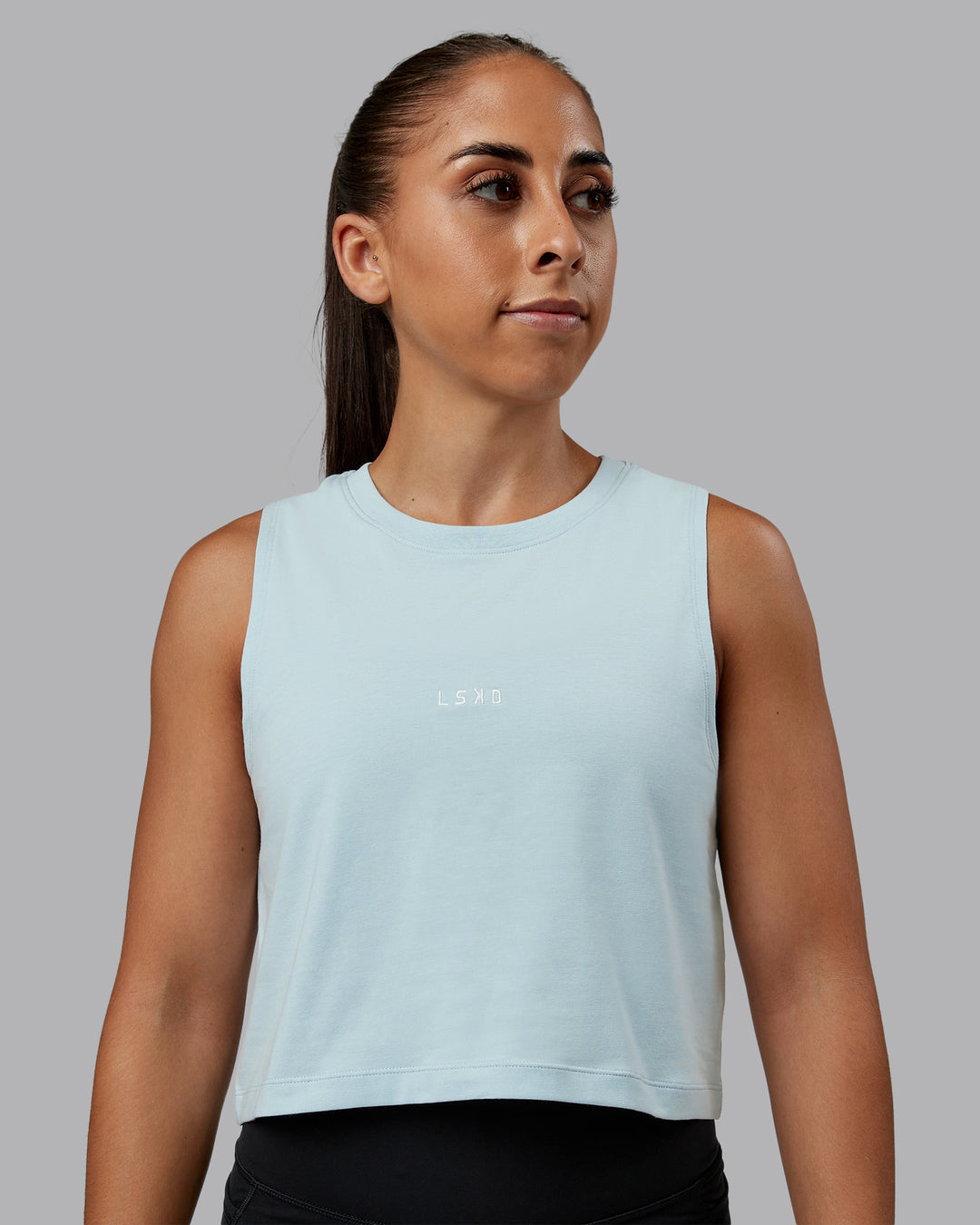 Woman wearing Go-To FLXCotton Tank in Skyride-White | Size:S | Model:Tylah - view 1