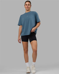 Woman wearing Go-To FLXCotton Oversized Tee - Elemental Blue-White | Thumbnail Index: 0