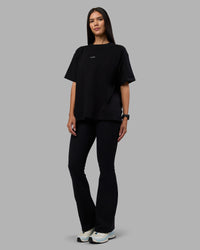 Woman wearing Go-To Heavyweight Oversized Tee - Black | Model:Rhiley | Size:S | Thumbnail Index: 1