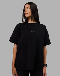 Woman wearing Go-To Heavyweight Oversized Tee - Black | Model:Rhiley | Size:S | Thumbnail Index: 0