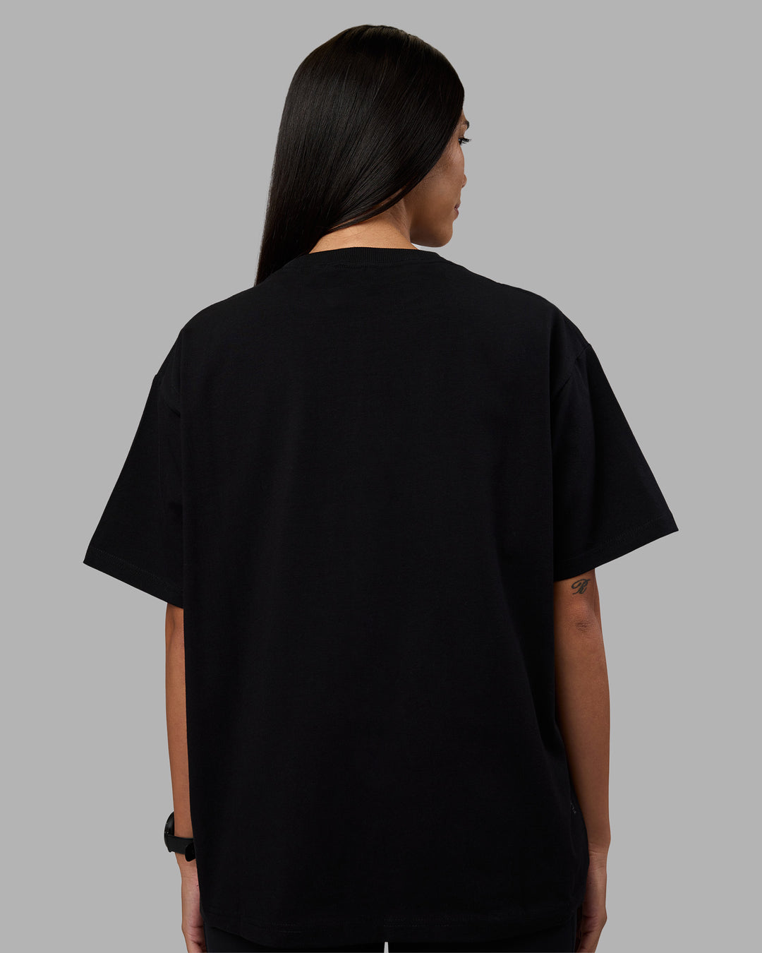 Woman wearing Go-To Heavyweight Oversized Tee - Black | Model:Rhiley | Size:S - view 3
