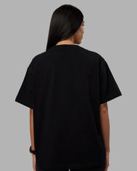 Woman wearing Go-To Heavyweight Oversized Tee - Black | Model:Rhiley | Size:S | Thumbnail Index: 2