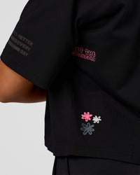 Woman wearing Go-To Heavyweight Reflective Skimmer Tee - Black-Reflective | Model:Kirstyn | Size:S | Thumbnail Index: 1