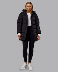 Woman wearing Go-To Puffer Long Jacket - Black | Model:Ella | Size:S | Thumbnail Index: 9