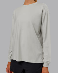 Woman wearing Go-To Long Sleeve FLXCotton Oversized Tee - Digital Mist-White | Model:Ella| Size:S | Thumbnail Index: 4