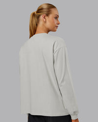 Woman wearing Go-To Long Sleeve FLXCotton Oversized Tee - Digital Mist-White | Model:Ella| Size:S | Thumbnail Index: 5