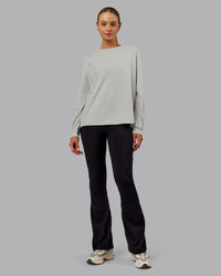 Woman wearing Go-To Long Sleeve FLXCotton Oversized Tee - Digital Mist-White | Model:Ella| Size:S | Thumbnail Index: 0