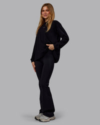 Woman wearing Go-To Long Sleeve FLXCotton Oversized Tee - Black-White | Model:Emilie | Size:S | Thumbnail Index: 3