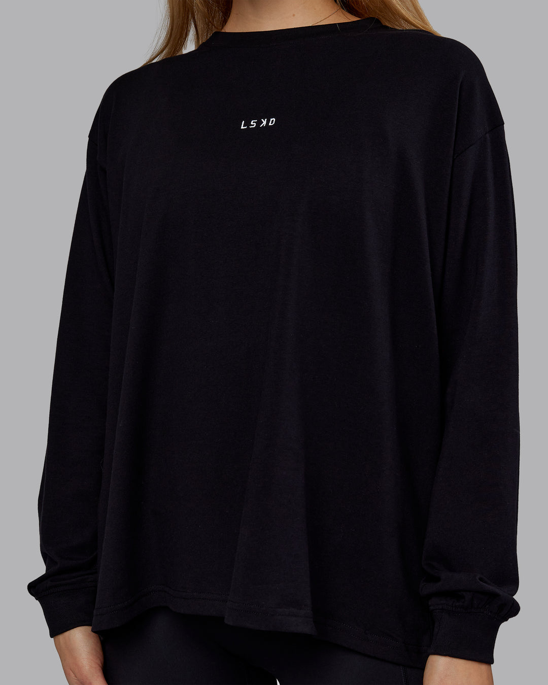 Woman wearing Go-To Long Sleeve FLXCotton Oversized Tee - Black-White | Model:Emilie | Size:S - view 5