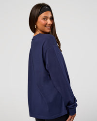 Woman wearing Go-To Long Sleeve FLXCotton Oversized Tee - Future Navy-White | Model:Bianca | Size:S | Thumbnail Index: 2