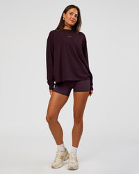 Woman wearing Go-To Long Sleeve FLXCotton Oversized Tee - Midnight Plum-White | Model:Bianca | Size:S | Thumbnail Index: 1