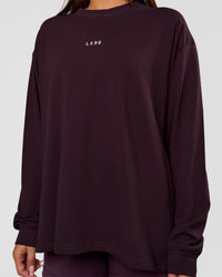 Woman wearing Go-To Long Sleeve FLXCotton Oversized Tee - Midnight Plum-White | Model:Bianca | Size:S | Thumbnail Index: 3