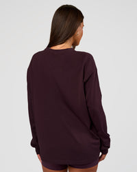 Woman wearing Go-To Long Sleeve FLXCotton Oversized Tee - Midnight Plum-White | Model:Bianca | Size:S | Thumbnail Index: 2