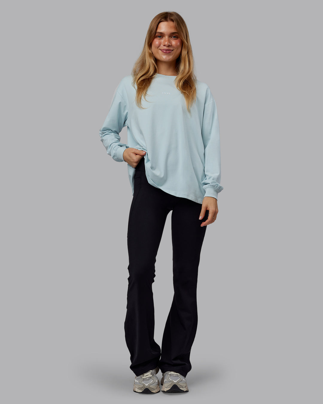 Woman wearing Go-To Long Sleeve FLXCotton Oversized Tee - Skyride-White | Model:Emilie | Size:S - view 1
