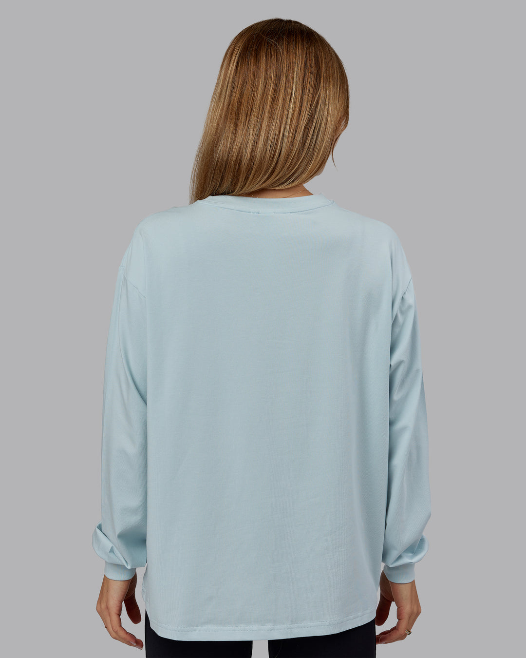 Woman wearing Go-To Long Sleeve FLXCotton Oversized Tee - Skyride-White | Model:Emilie | Size:S - view 3