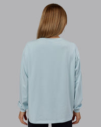 Woman wearing Go-To Long Sleeve FLXCotton Oversized Tee - Skyride-White | Model:Emilie | Size:S | Thumbnail Index: 2